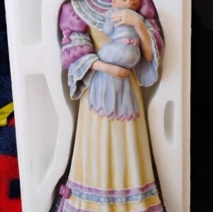 Cherished memories woman holding baby porcelain doll